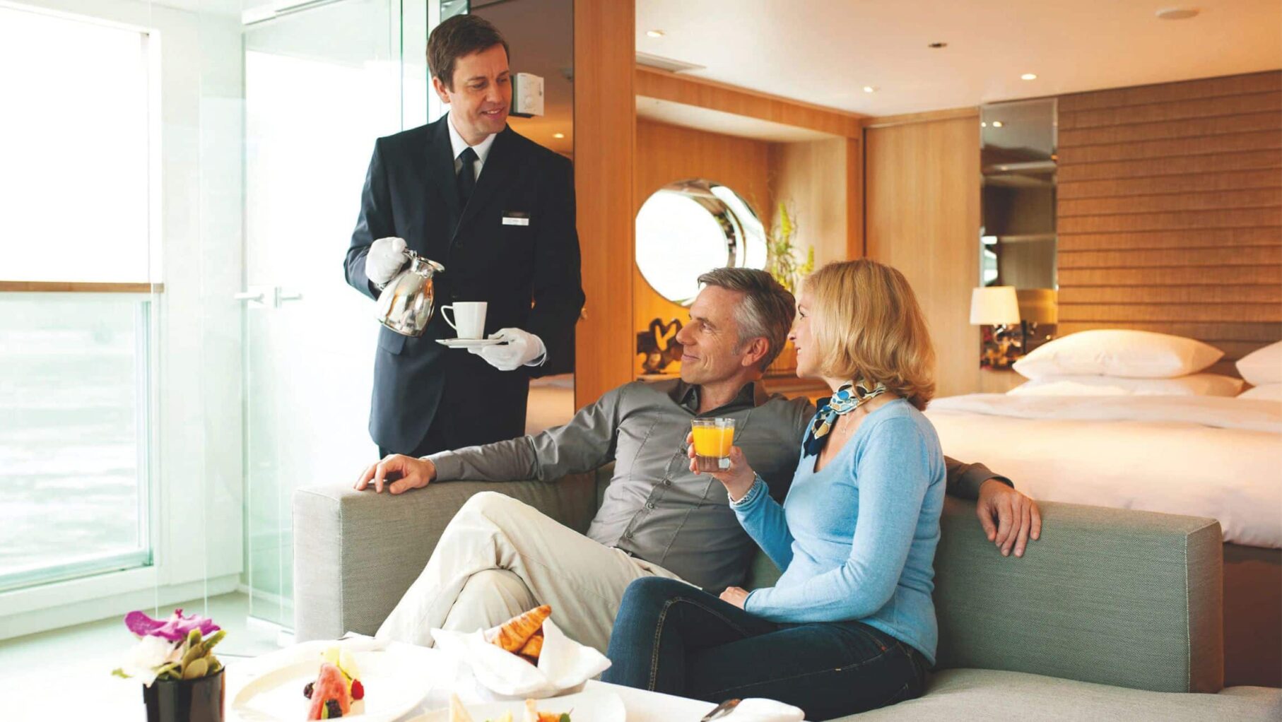 A couple in their suite on a Scenic space ship