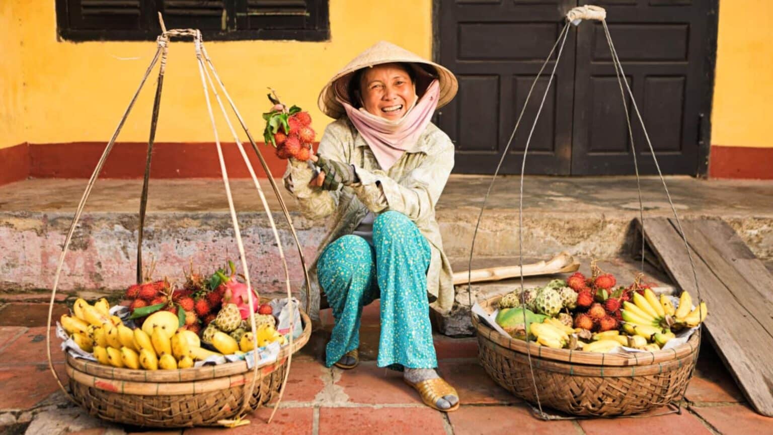 A woman in a Vietnamese market travelmarvel