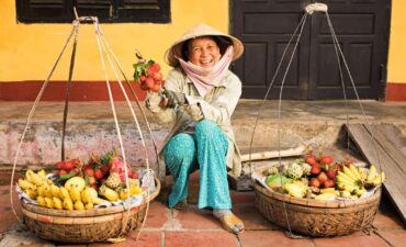 A woman in a Vietnamese market travelmarvel