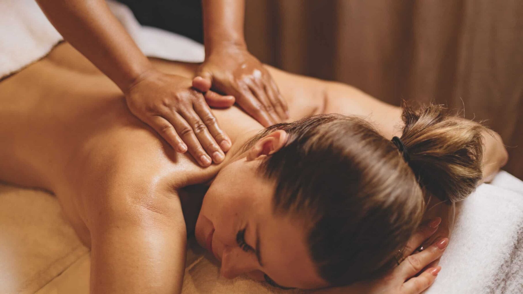 Woman getting a massage on the APT Solara