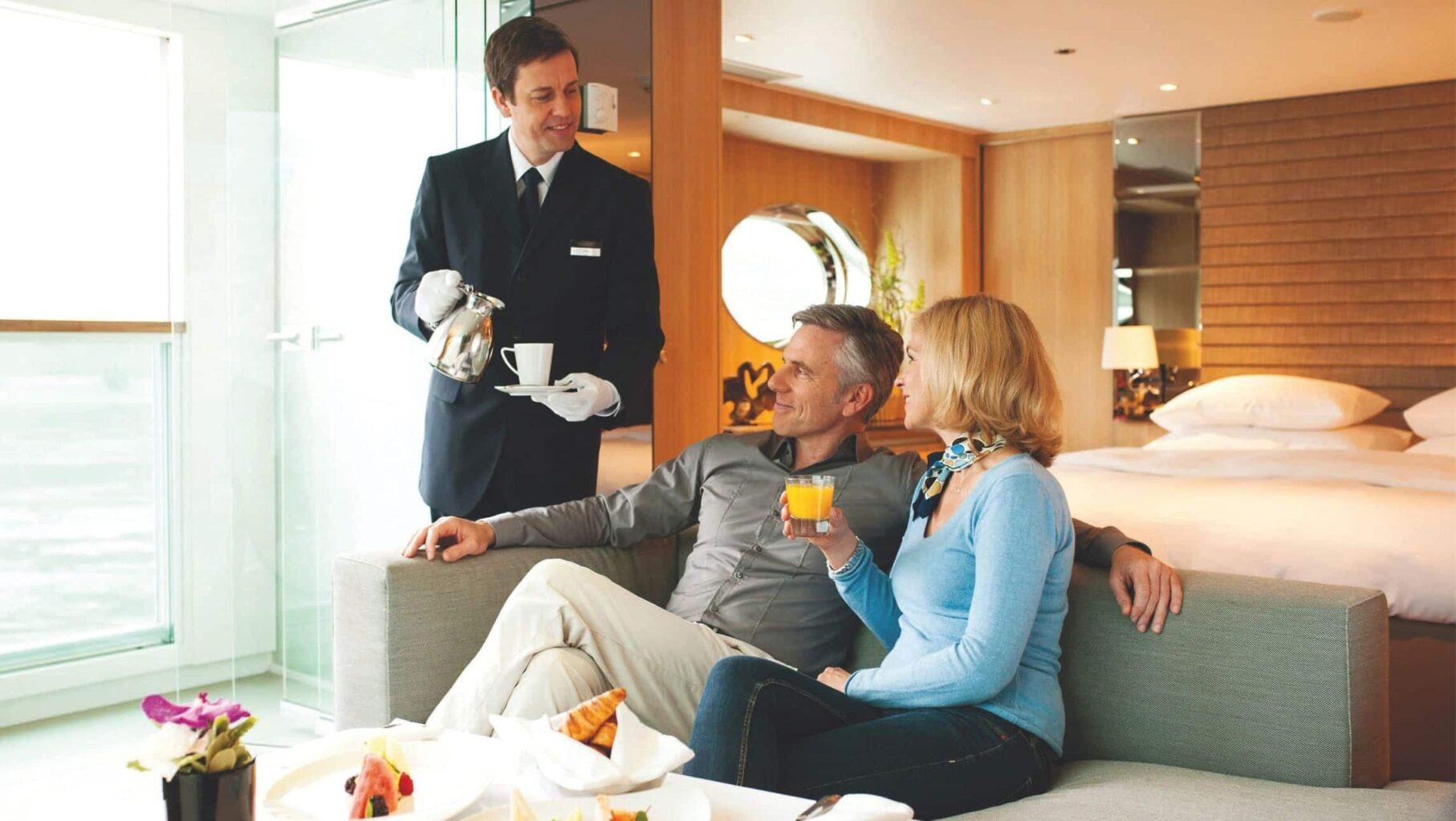 river cruise passengers enjoying a tea with their butler