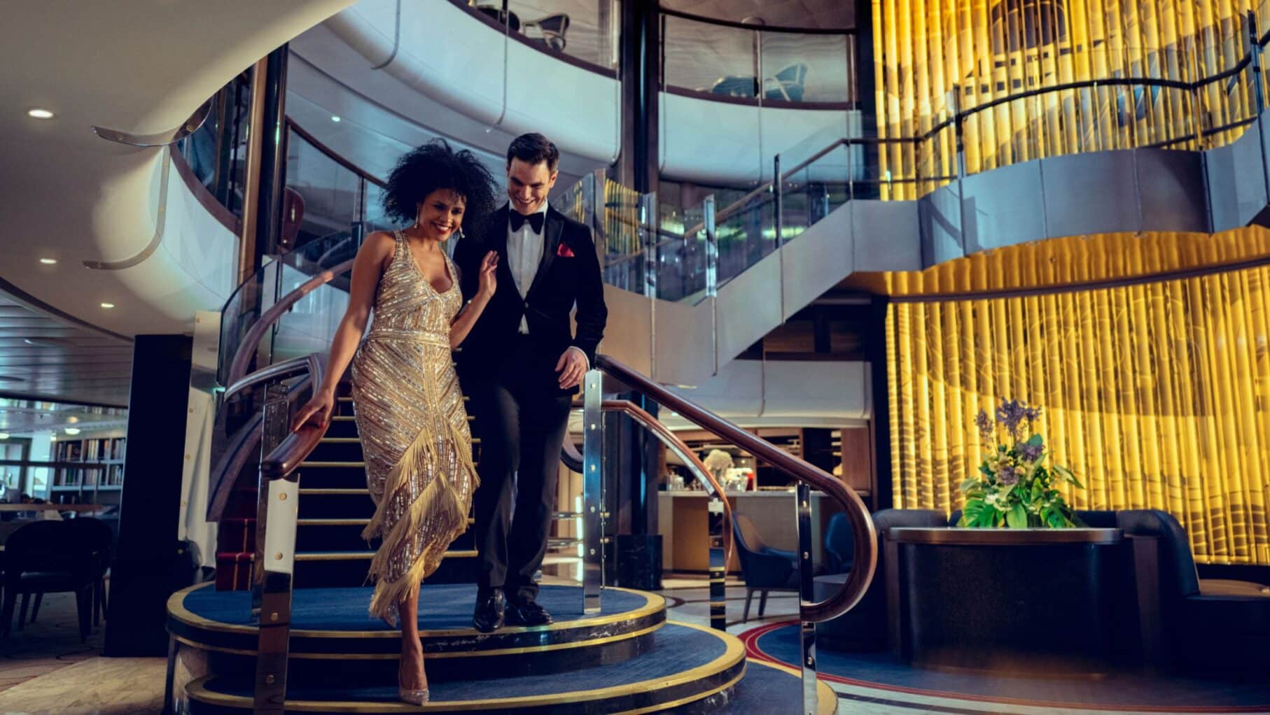 Cunard entertainment woman walking down the stairs