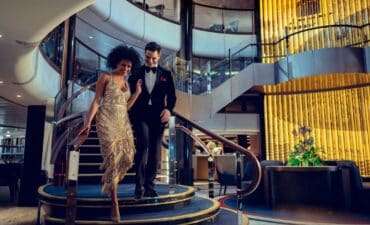 Cunard entertainment woman walking down the stairs