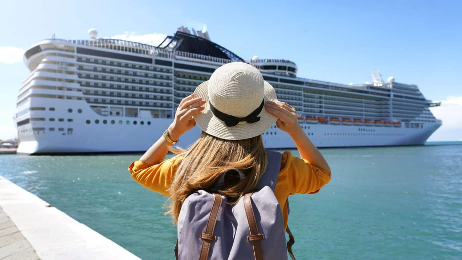 Woman looking at cruise ship