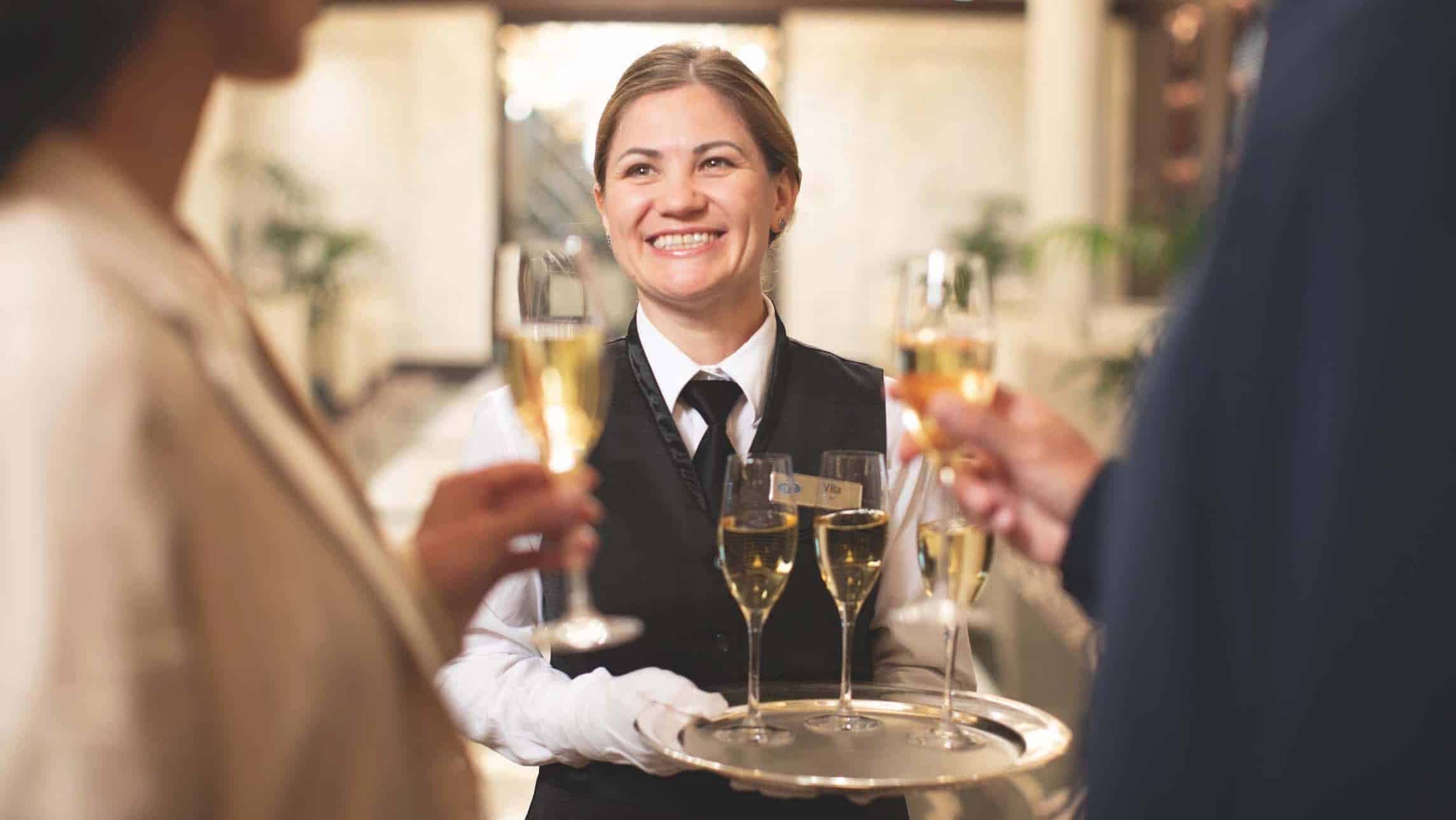 Guests are welcome aboard Regent Sevens Seas with a glass of champagne.