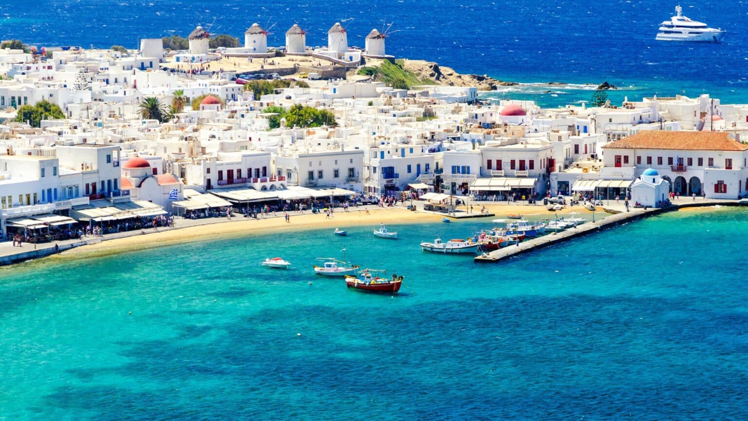 Vibrant coastal town with windmills