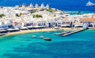 Vibrant coastal town with windmills