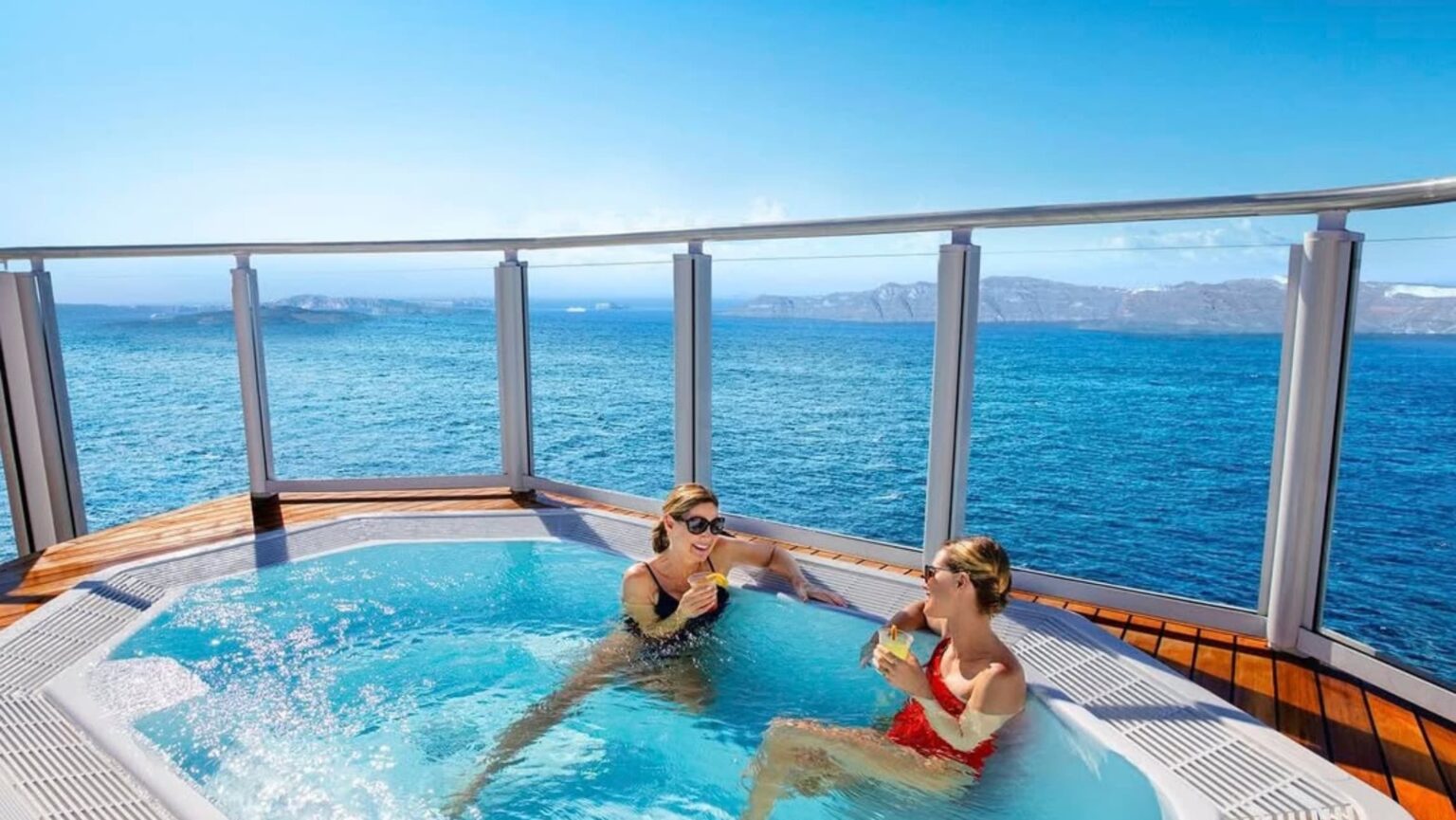 Two woman relax at a spa on an NCL ship