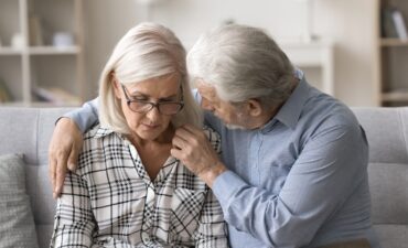 Elderly couple sharing a moment.