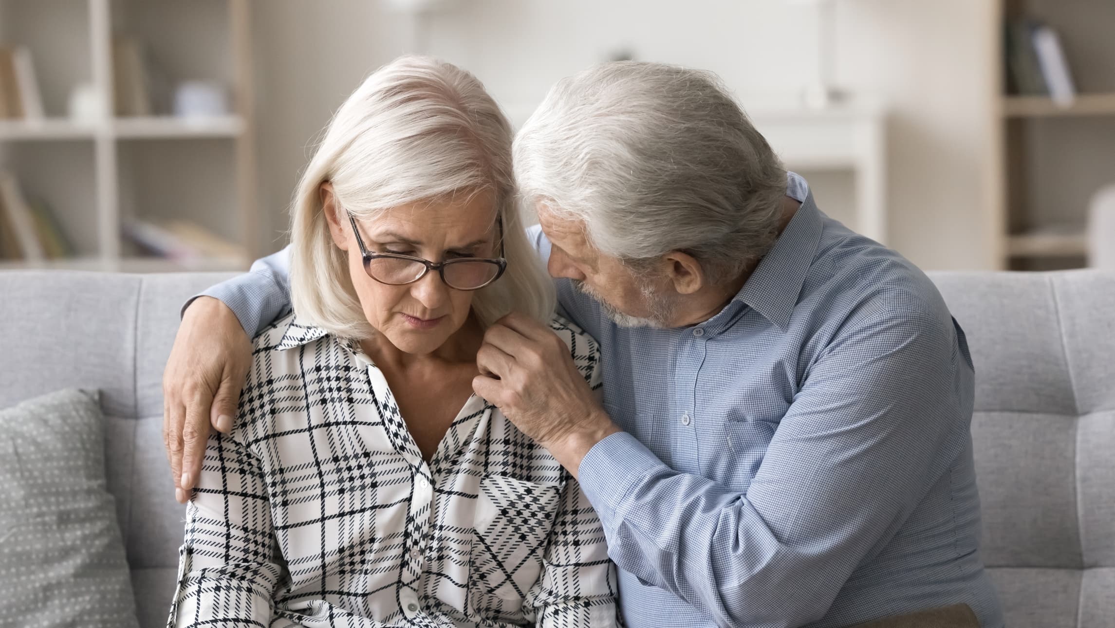 Elderly couple sharing a moment.