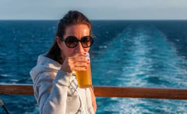 Woman drinking on a cruise ships