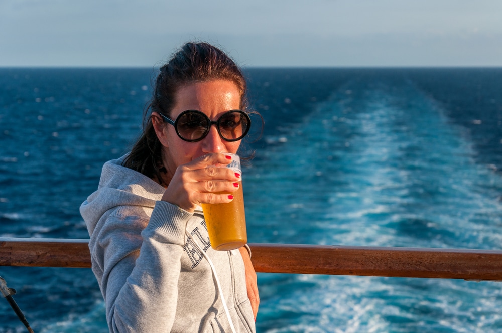 Woman drinking on a cruise ships