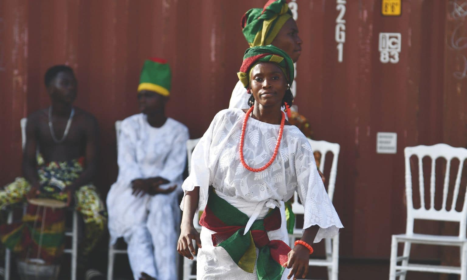 Accra dancer welcoming passengers from ship