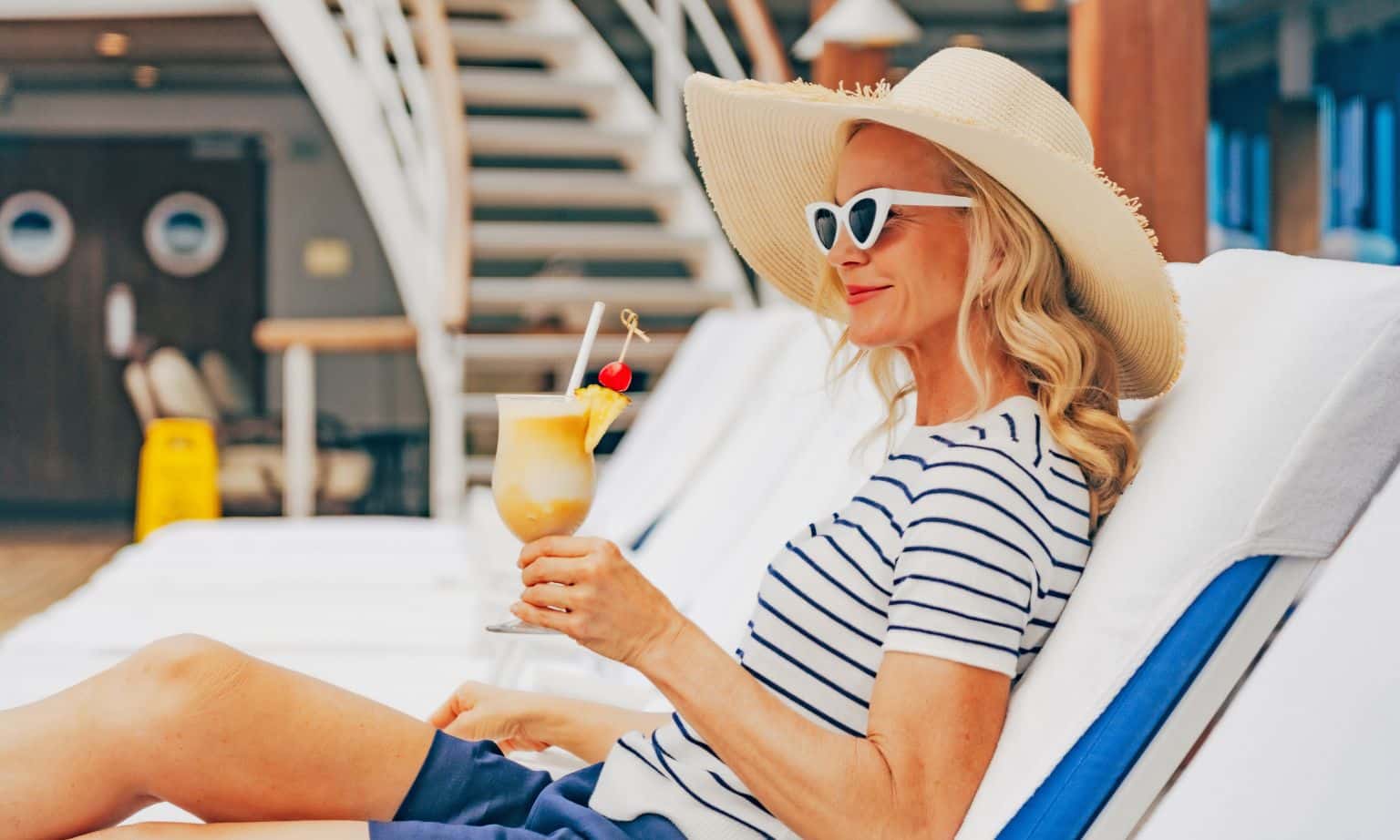 A woman enjoying a cocktail