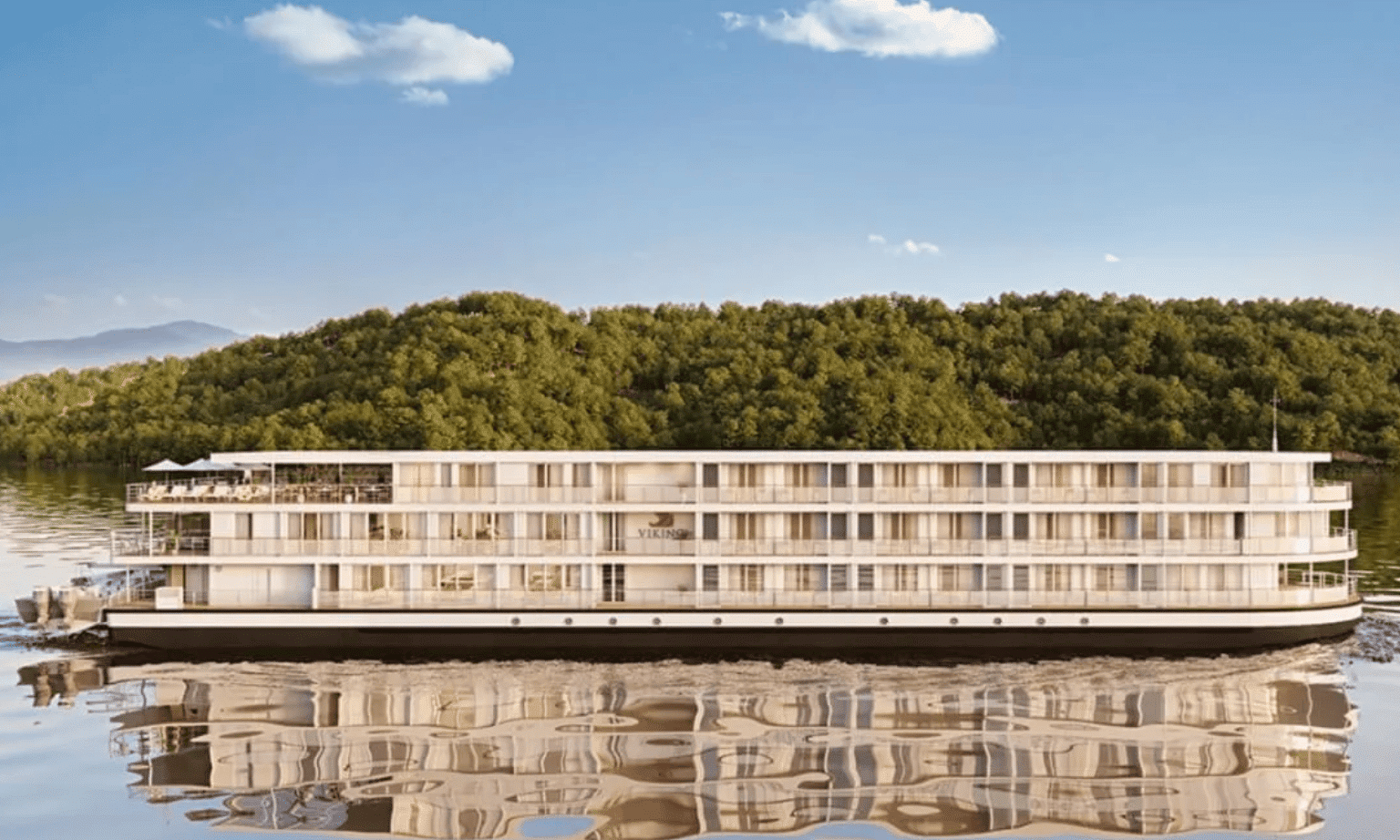 A side on view of a three storey river cruise ship on a river