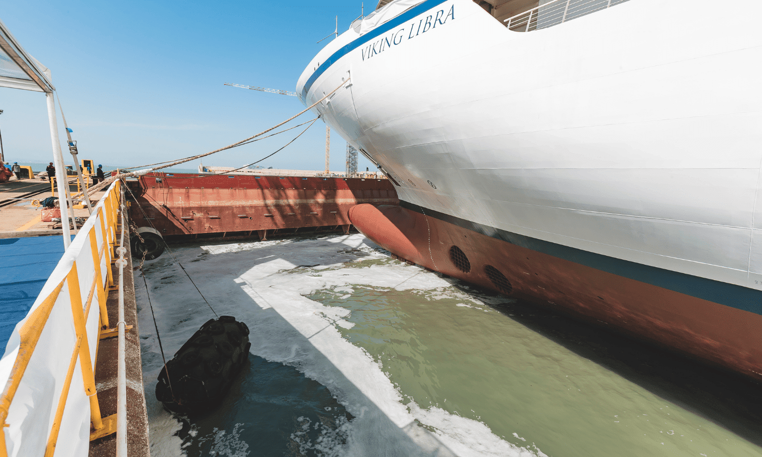 The hydrogen cruise ship Viking Libra sits in water in a building dock in Ancona.