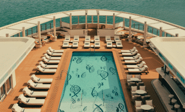 A pool surrounded by lounges on the luxury yacht Four Seasons 1