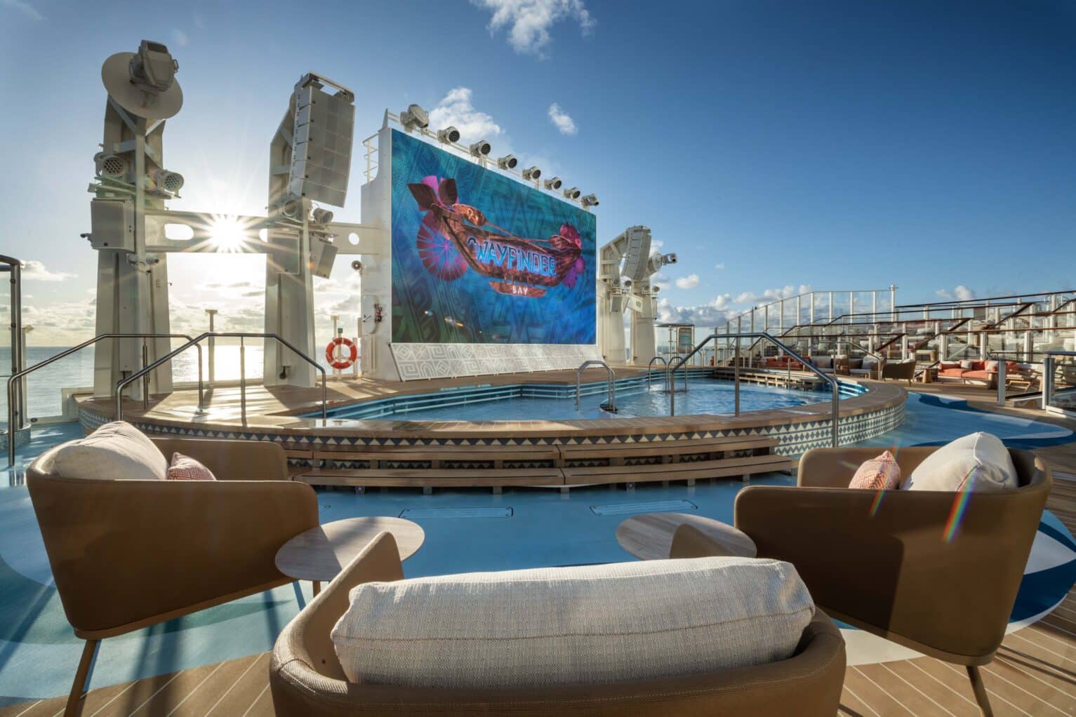 Wayfinder Bay, an open-air oasis under the sun, is where relaxation and exclusive entertainment await onboard the Disney Adventure. Tucked away at the back of the ship, this tranquil pool area features plush seating and loungers arranged among tiered decks, offering some of the most stunning views of land, sea and sky. (Kent Phillips, photographer)