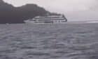 black and white image of cruise ship grounded in fiji near island Cast Away island