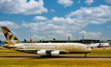 A Middle East airline Etihad plane sits on the tarmac