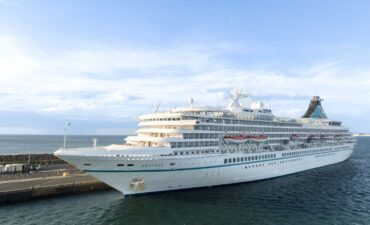 A large white cruise ship docked at one of Australia's cruise ports in WA