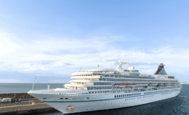 A large white cruise ship docked at one of Australia's cruise ports in WA