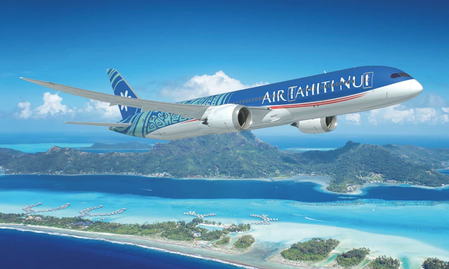 An Air Tahiti Nui plane flying over Tahiti