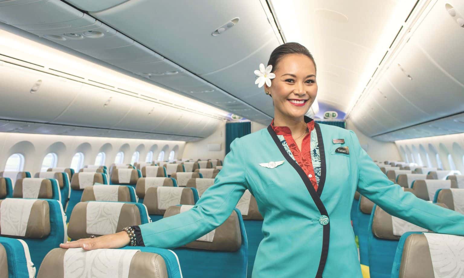 An Air Tahiti Nui stewardess in economy